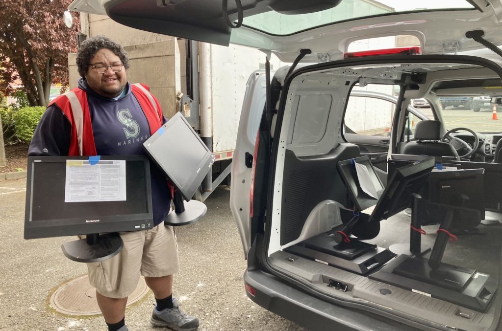 A hunger relief partner picking up computers from our offices