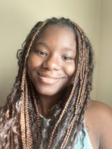 A headshot of Abby, our new Harvest VISTA member.